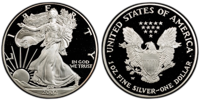 Side-by-side comparison of 2002 Silver Eagle MS67 with milk spots versus pristine MS70 specimen